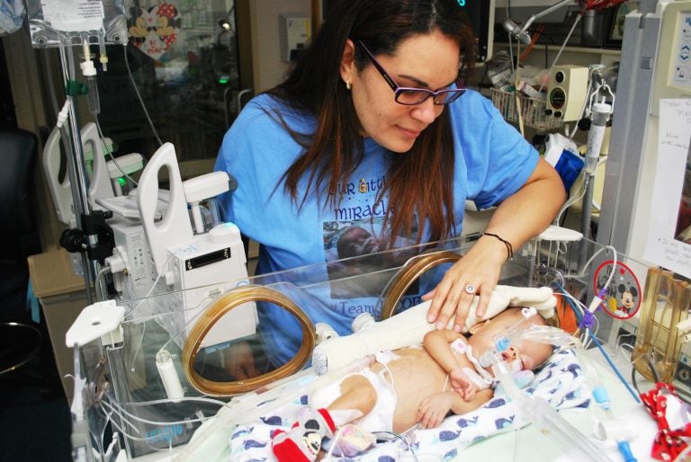 Roxannie Vazquez watches over her son Jacob Ramiro at the neo-natal intensive care unit of a hospital in Macon, Georgia. He suffers from chronic lung disease. His mom says mold grew in his ventilator in Puerto Rico after Hurricane Maria damaged the pediatric hospital in San Juan. (Emily Cureton)