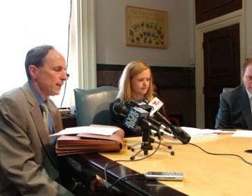 Rob Dubow (left), Philadelphia finance director, and others discuss school funding in the City Council's budget plan. (Tom MacDonald/ WHYY)