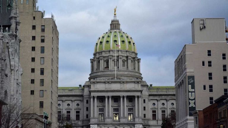 A view of the State Capitol building in Harrisburg, Pa., with a cloudy sky in the background.