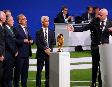 FIFA President Gianni Infantino, right, welcomes representatives of the united bid -- from the U.S., Canada, and Mexico -- as soccer's governing body selects its host for the 2026 FIFA World Cup during the 68th FIFA Congress in Moscow, Russia.