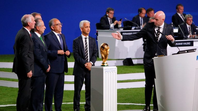 FIFA President Gianni Infantino, right, welcomes representatives of the united bid -- from the U.S., Canada, and Mexico -- as soccer's governing body selects its host for the 2026 FIFA World Cup during the 68th FIFA Congress in Moscow, Russia.