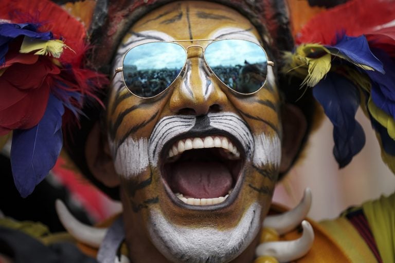 Colombian soccer fan Jose Florentino poses for photos ahead of the 2018 soccer World Cup at a square downtown Moscow, Russia, Wednesday, June 13, 2018. (AP Photo/Felipe Dana)