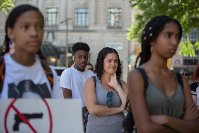 A member of the crowd becomes emotional as students from Parkway Center City Middle College give impassioned speeches about the gun violence in their communities. Around 70 supporters gathered together for a march from the Philadelphia Art Museum to Independence Mall 105 days after the 