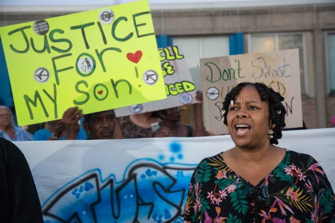 Tracey Wells-Huggins, a Vineland community member, gives an impassioned speech about the necessity of community, love, and understanding of one another. Dozens of community members came together on July 19th 2018 to march to the city police station to demand justice for the death of Rashaun “Pacman” Washington who was shot and killed by police on July 14th 2018. (Emily Cohen for WHYY)