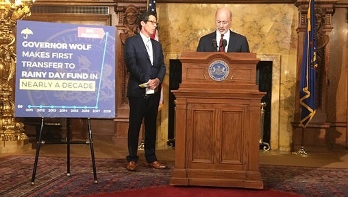 Governor Tom Wolf and Treasurer Joe Torsella announced Thursday that the state can afford to put money into its Rainy Day fund for the first time in a decade. (Katie Meyer/WITF)