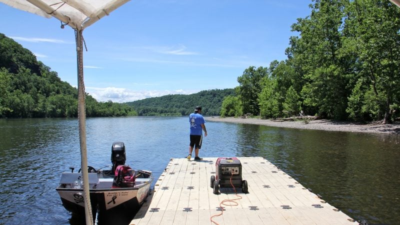 It's just another day at the office for Mathew Crance, who runs Delaware River Tubing and The Famous River Hot Dog Man with his father and three brothers. (Emma Lee/WHYY)