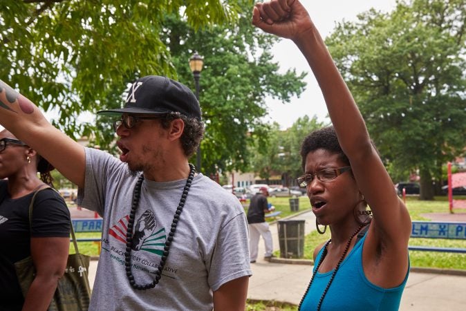 Ismael Jiminez, 36, stands next to his wife, Ashley Jiminez, 32 at the Solidarity for Antwon Rose Rally in Philadelphia on July 1, 2018. Together they chant, 