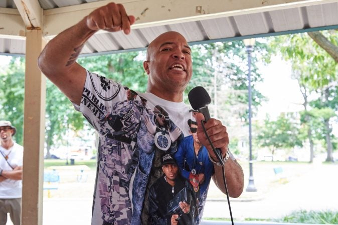 Will Mega, 45, of West Philadelphia, speaks during the Antwon Rose Rally in Philadelphia, PA on July 1, 2018. He believes economic boycotts are the greatest tool against global white supremacy. (Natalie Piserchio for WHYY)