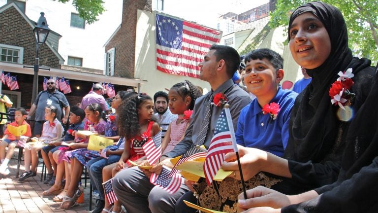 Thirteen children from seven nations took the Oath of Allegience to become U.S. citizens during a naturalization ceremony at the Betsy Ross House in Philadelphia on July 4, 2018. (Emma Lee/WHYY)
