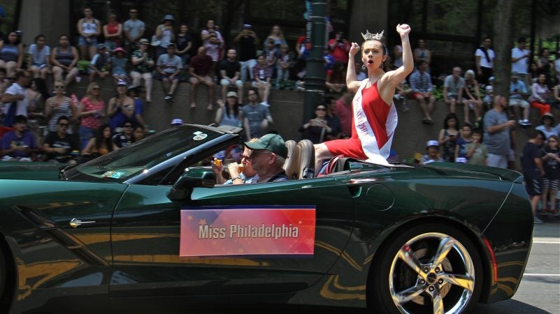 Miss Philadelphia Aimee Turner plays to the crowd during the Philadelphia Independence Day parade. (Emma Lee/WHYY)
