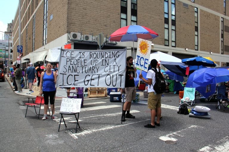 Protesters camped outside Immigration and Customs Enforcement (ICE) offices at 8th and Cherry streets are demanding that Mayor Jim Kenney end the city's data sharing contract with ICE.