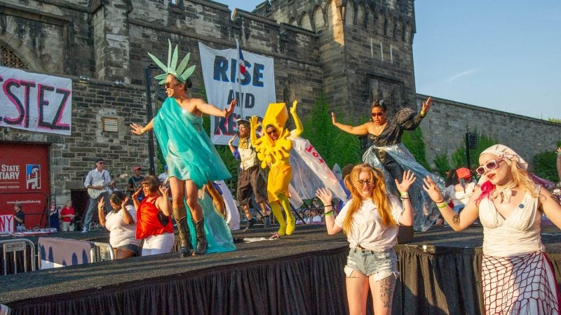 On stage, the Statue of Liberty, portrayed by Messapotamia Lefae, Butter, portrayed by Virgil Gadson, and Sojourner Truth, played by Veronica Chapman Smith, lead the Bearded Ladies in the cabaret's finale. (Jonathan Wilson for WHYY)