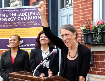 Homeowner Joan Kimball celebrates her home's conversion to solar power under a the Philadelphia Energy Campaign. Kimball's home, on Fairmount Avenue, became the 150th to go solar since the launch of the campaign to promote clean energy and create jobs