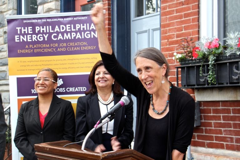 Homeowner Joan Kimball celebrates her home's conversion to solar power under a the Philadelphia Energy Campaign. Kimball's home, on Fairmount Avenue, became the 150th to go solar since the launch of the campaign to promote clean energy and create jobs