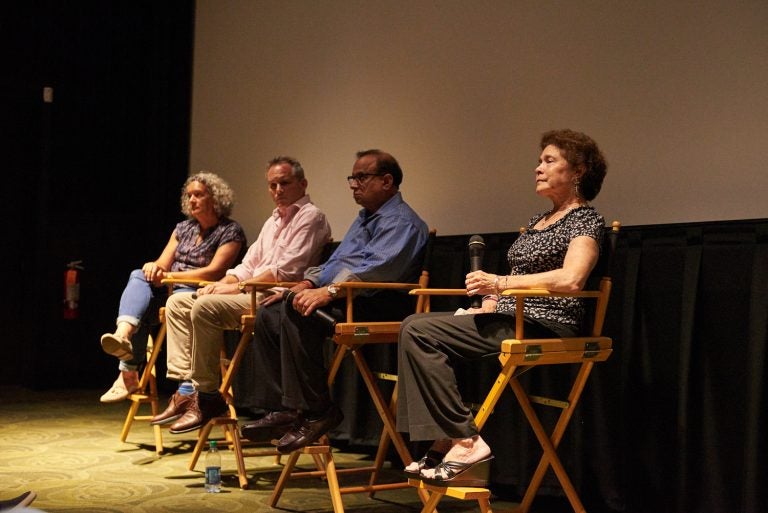 (From left) Executive Producer Elisa Gambino; Director Neal Broffman; father, Akhil Tripathi;  and mother, Judy Tripathi; during a Q&A after a screening of 2015 documentary, Help Us Find Sunil Tripathi. The documentary was screened in Sunil's hometown for the first time on July 26, 2018, at the Bryn Mawr Film Institute, in Sunil's hometown. (Natalie Piserchio for WHYY)