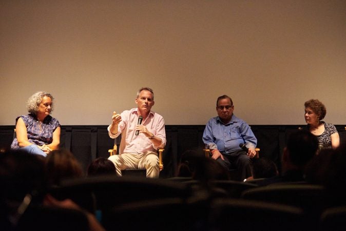 (From left) Executive Producer Elisa Gambino; Director Neal Broffman; father, Akhil Tripathi;  and mother, Judy Tripathi; during a Q&A after a screening of 2015 documentary, Help Us Find Sunil Tripathi. The documentary was screened in Sunil's hometown for the first time on July 26, 2018, at the Bryn Mawr Film Institute, in Sunil's hometown. (Natalie Piserchio for WHYY)