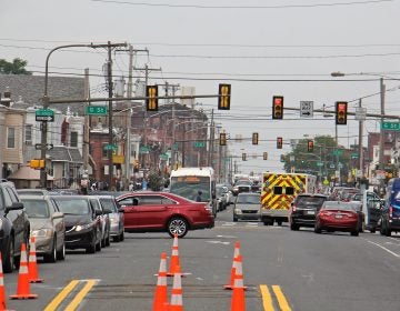 An ambulance threads through traffic on Allegheny Avenue, an area that experienced an uptick in overdoses apparently caused by heroin cut with a synthetic cannabinoid.