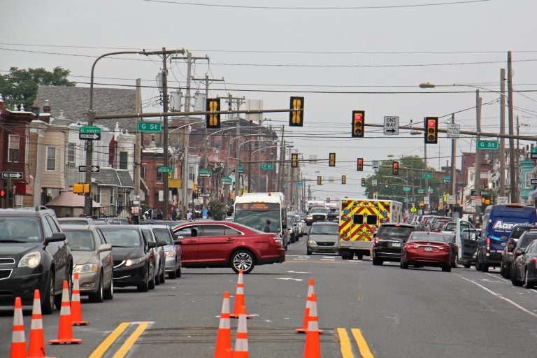 An ambulance threads through traffic on Allegheny Avenue, an area that experienced an uptick in overdoses apparently caused by heroin cut with a synthetic cannabinoid.