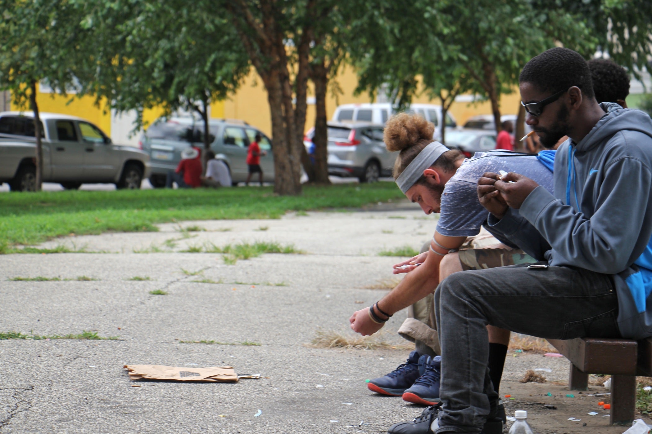 A user injects himself on a bench at McPherson Square. 