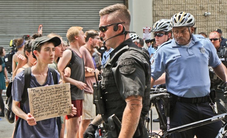 Police began arresting protesters at Philadelphia’s ICE offices at Eighth and Cherry streets around noon. (Kimberly Paynter/WHYY)