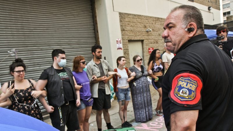 Police confront protesters at Philadelphia’s ICE office at Eighth and Cherry streets Tuesday. (Kimberly Paynter/WHYY)