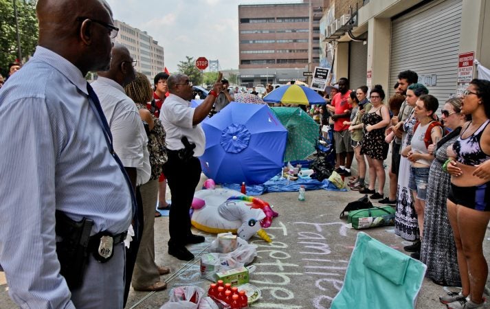 Police confront protesters  calling for the end of ICE among other demands. (Kimberly Paynter/WHYY)