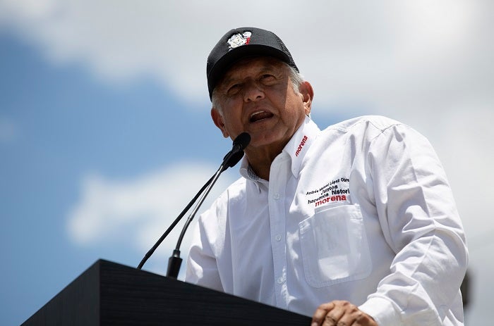 Presidential candidate Andres Manuel Lopez Obrador, known as AMLO, speaks to supporters at a campaign rally in Mexico City, Sunday, June 3, 2018. Mexico will hold general elections on July 1. (AP Photo/Anthony Vazquez)