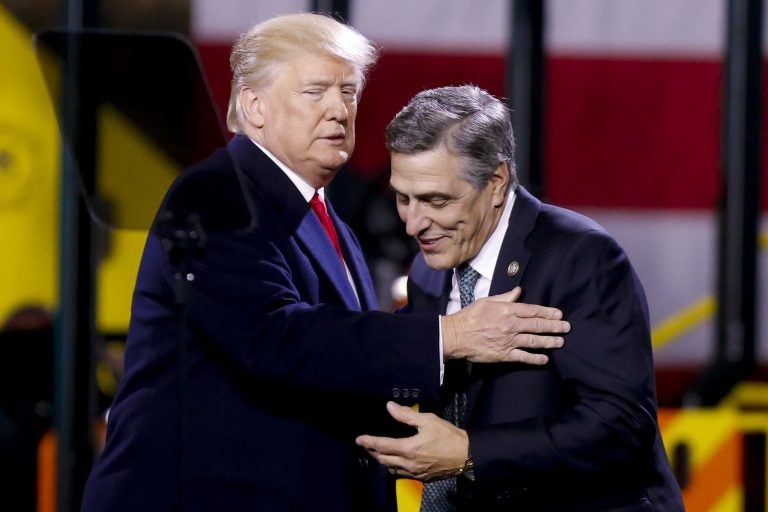 President Donald Trump, (left), greets Pa. Rep. Lou Barletta, R.Pa., before a speech at H&K Equipment Co. on Thursday, Jan. 18, 2018 in Coraopolis, Pa. Barletta is running for the U.S. Senate. (Keith Srakocic/AP Photo)