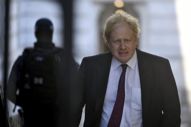 Britain's Foreign Secretary Boris Johnson, leaves the Foreign Office on his way to Downing Street for a cabinet meeting, in London, Tuesday June 26, 2018.  Johnson visited Afghanistan for talks on Monday, missing a crucial parliamentary vote on expanding London's Heathrow Airport. (Victoria Jones/PA via AP)