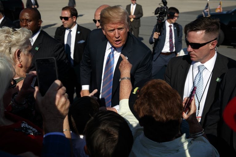 President Donald Trump greets supporters after arriving at the Greenbrier Valley Airport in Lewisburg, W.Va., before attending a 