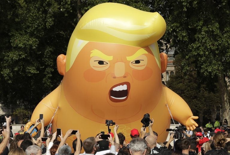 A six-meter high cartoon baby blimp of U.S. President Donald Trump is flown as a protest against his visit, in Parliament Square in London, England, Friday, July 13, 2018. Trump is making his first trip to Britain as president after a tense summit with NATO leaders in Brussels and on the heels of ruptures in British Prime Minister Theresa May's government because of the crisis over Britain's exit from the European Union. (Matt Dunham/AP Photo)