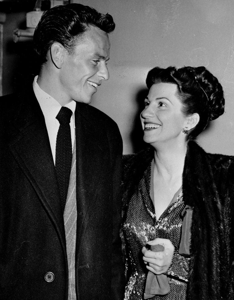 In this Oct. 23, 1946 file photo, singer Frank Sinatra and his wife Nancy smile broadly as they leave a Hollywood night club following a surprise meeting. Nancy Sinatra Sr., the childhood sweetheart of Frank Sinatra who became the first of his four wives and the mother of his three children, has died. She was 101. (AP Photo/File)