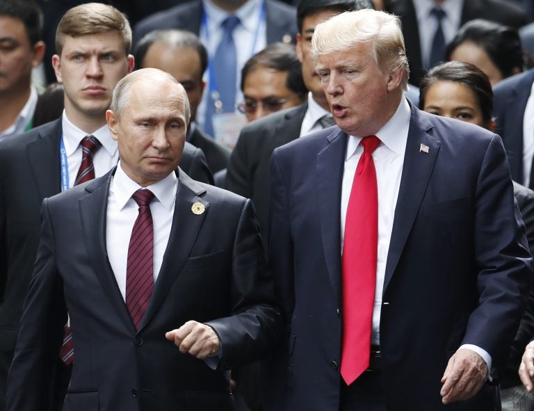 In this Nov. 11, 2017 file photo, U.S. President Donald Trump and Russia's President Vladimir Putin talk during the family photo session at the APEC Summit in Danang, Vietnam. The outcome of the first summit between the unpredictable first-term American president and Russia’s steely-eyed longtime leader is anybody’s guess. With no set agenda, the summit could veer between spectacle and substance. As Donald Trump and Vladimir Putin head into their meeting, Monday, July 16, 2018 in Helsinki, here’s a look at what each president may be hoping to achieve(Jorge . Silva/Pool Photo via AP, File)