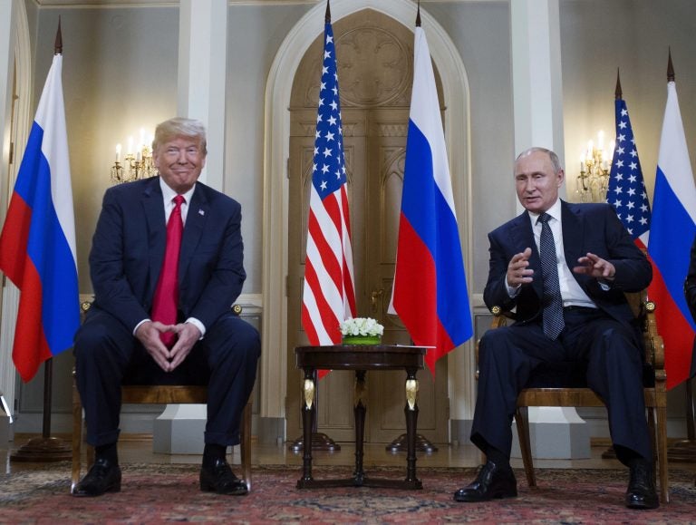 Russian President Vladimir Putin, right, makes a statement as U.S. President Donald Trump, left, looks on at the beginning of a meeting at the Presidential Palace in Helsinki, Finland, Monday, July 16, 2018.