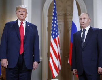 President Donald Trump and Russian President Vladimir Putin pose for a photograph at the beginning of a one-on-one meeting at the Presidential Palace in Helsinki, Finland. (AP Photo/Pablo Martinez Monsivais)
