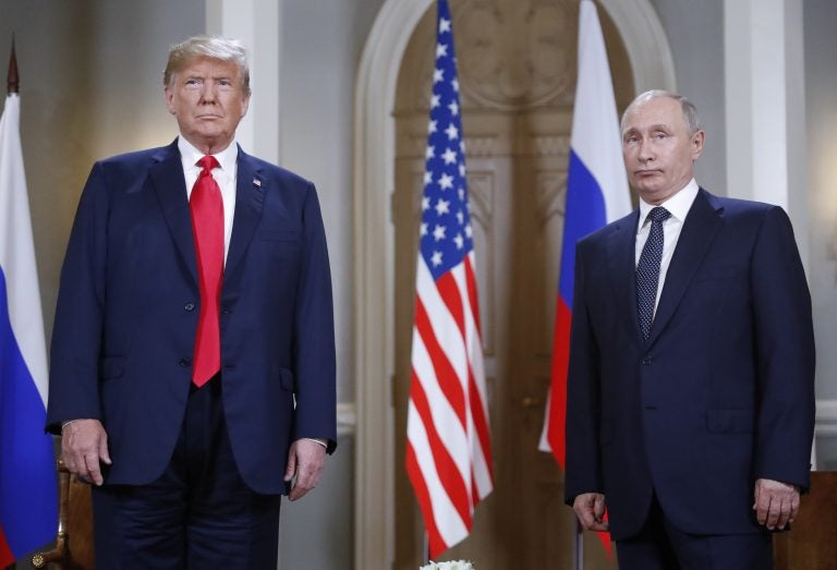 President Donald Trump and Russian President Vladimir Putin pose for a photograph at the beginning of a one-on-one meeting at the Presidential Palace in Helsinki, Finland. (AP Photo/Pablo Martinez Monsivais)