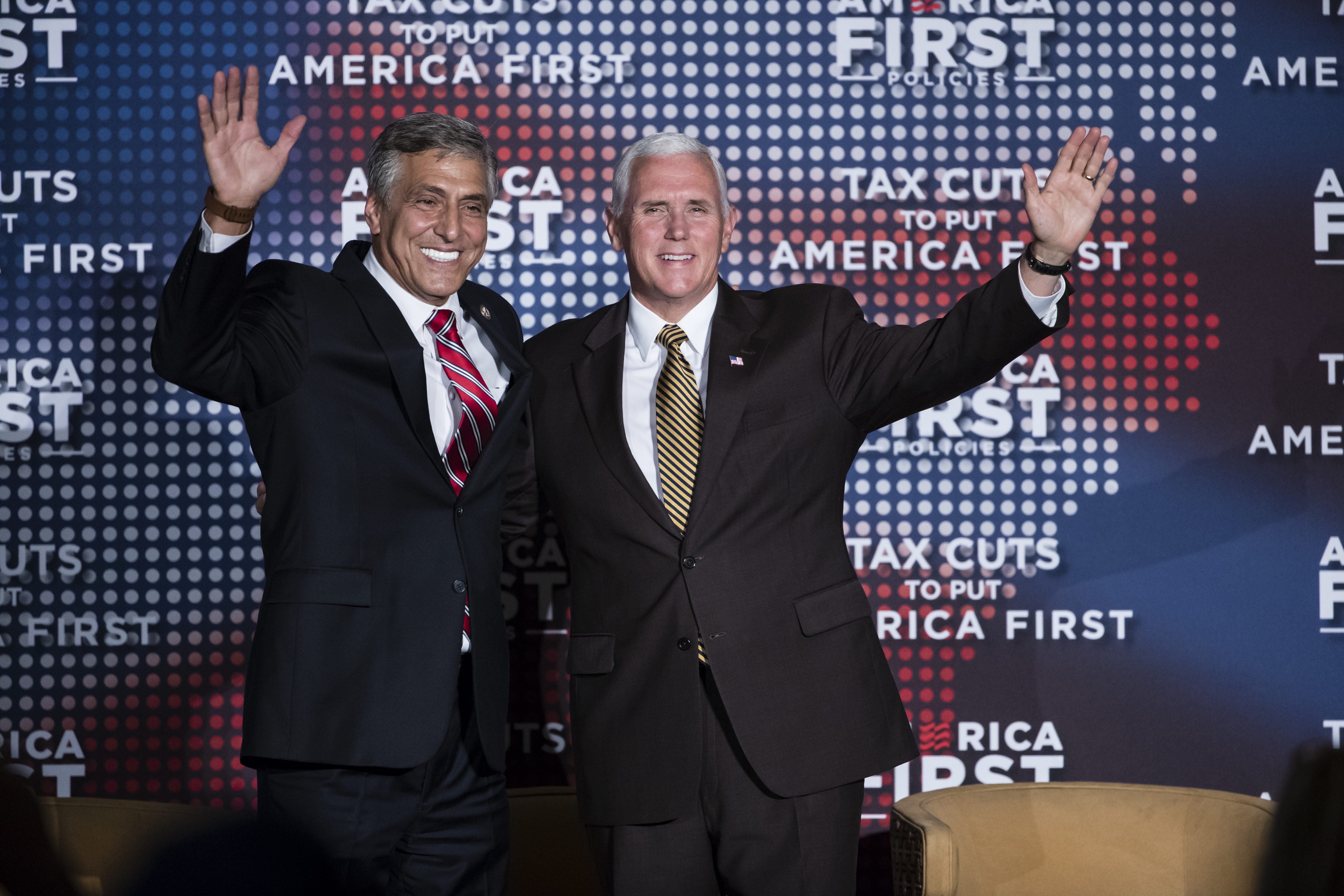Republican U.S. Senate candidate Rep. Lou Barletta, R-Pa., left, and Vice President Mike Pence wave to audience members at an America First Policies event in Philadelphia, Monday, July 23, 2018.