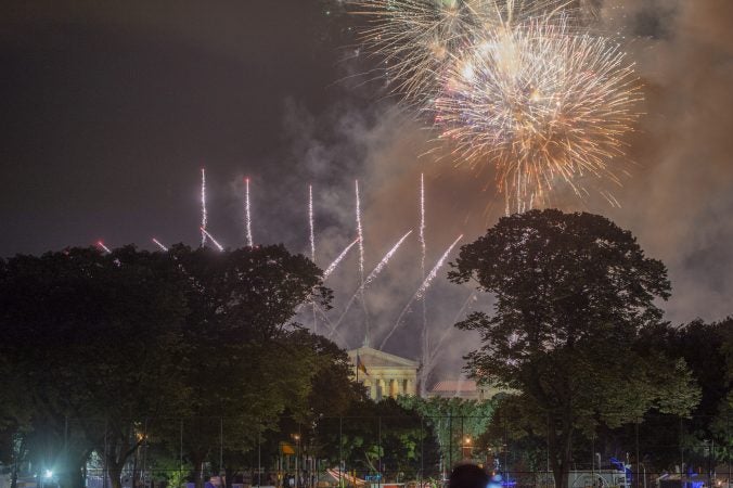 Fireworks rise above the Philadelphia Museum of Art seen from Von Colln Athletic Field. (Jonathan Wilson for WHYY)