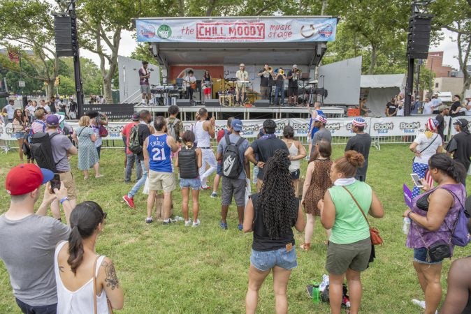 A crowd gathers to watch Max Swan perform with his band. (Jonathan Wilson for WHYY)