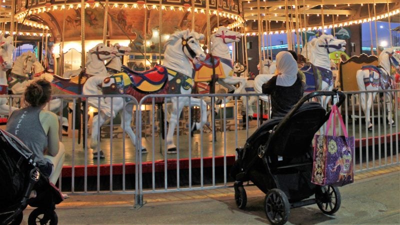The carousel at Gillian’s Wonderland Pier on the Ocean City Boardwalk dates from 1926 and remains a favorite of young riders. (Bill Barlow/for WHYY)