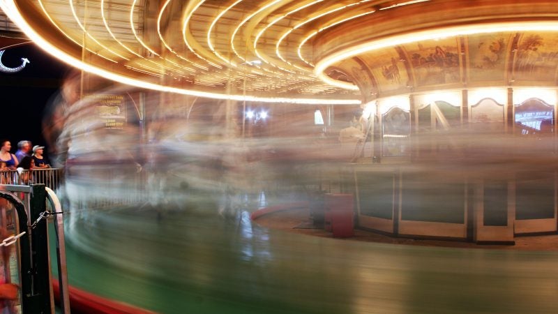 
The riders blur by as they reach for the ring on the carousel at Gillian’s Wonderland Pier in Ocean City. (Bill Barlow/for WHYY)