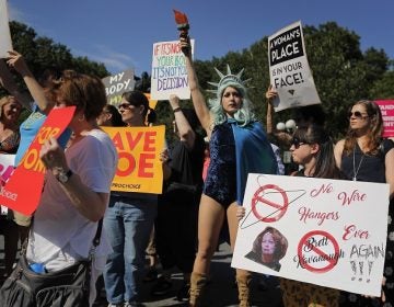 Women demonstrate during a pro-choice rally, Tuesday, July 10, 2018, in New York. Many Democrats and abortion-rights supporters believe a new conservative justice could tilt the court in favor of overturning Roe v. Wade. (AP Photo/Julie Jacobson)