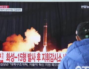 A man watches a TV screen showing what the North Korean government calls the Hwasong-15 intercontinental ballistic missile, at the Seoul Railway Station in Seoul, South Korea, in November.
