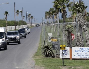 All day, unmarked white vans and chartered buses carrying the migrant children released from shelters across the country roll into the parking lot of the Port Isabel Detention Center in south Texas. (David J. Phillip/AP)