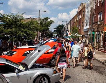 Summer visitors flock to the Passyunk Avenue car show in July.
