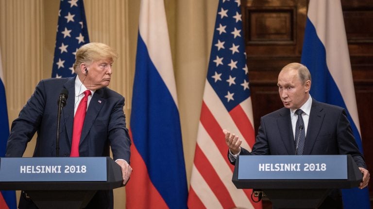 President Trump and Russian President Vladimir Putin answer questions during a joint press conference after their summit on July 16 in Helsinki. (Chris McGrath/Getty Images)