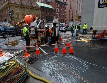 Verizon crews pump water from an access tunnel in Manhattan in 2012 after flooding from Superstorm Sandy knocked out underground Internet cables. (Stan Honda/AFP/Getty Images)