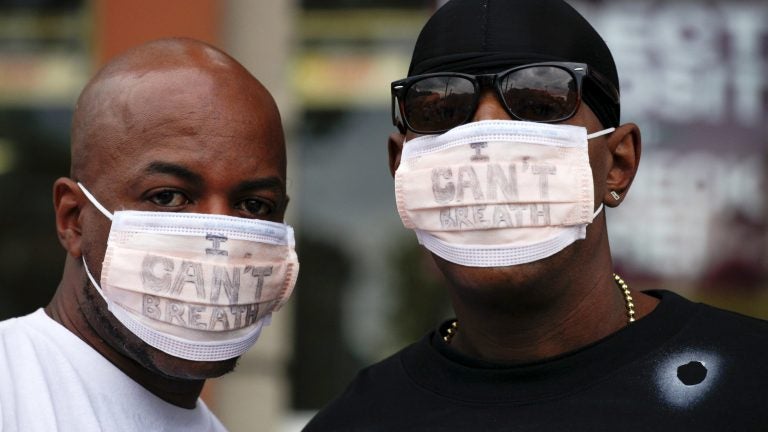 New York City police are giving the Justice Department a deadline to announce criminal charges in the 2014 death of Eric Garner. Garner's death spurred protests, including by two men who wore medical masks reading 