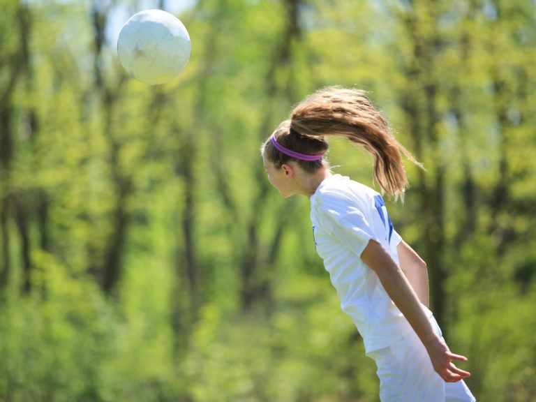 The brains of female soccer players who head the ball frequently show white matter alterations. (Krista Long/Getty Images)