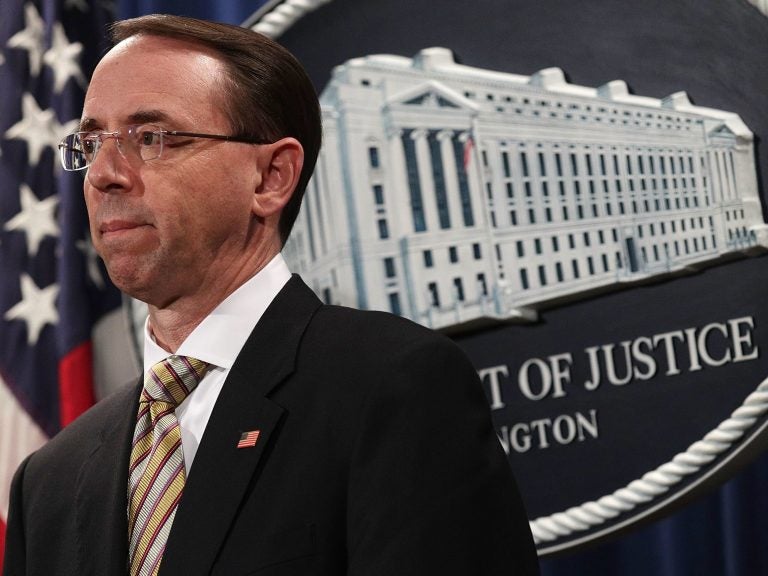 Deputy U.S. Attorney General Rod Rosenstein convened a press conference at the Justice Department on Friday. (Alex Wong/Getty Images)
